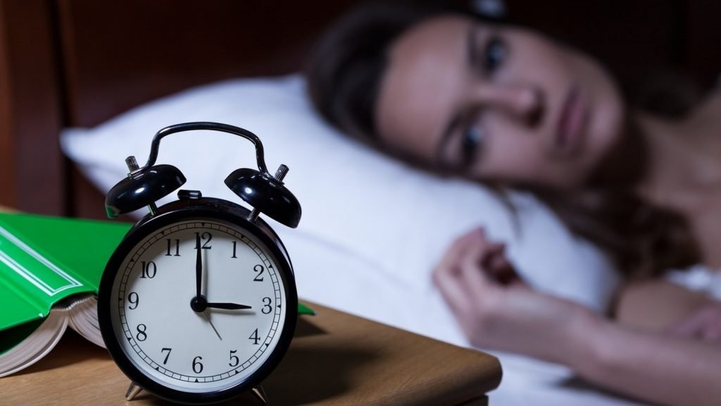 alarm clock woman can't sleep